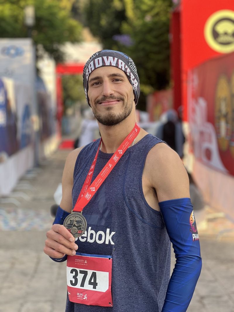 Fuad Abu Safi with his medal at the Bromine Amman Half Marathon